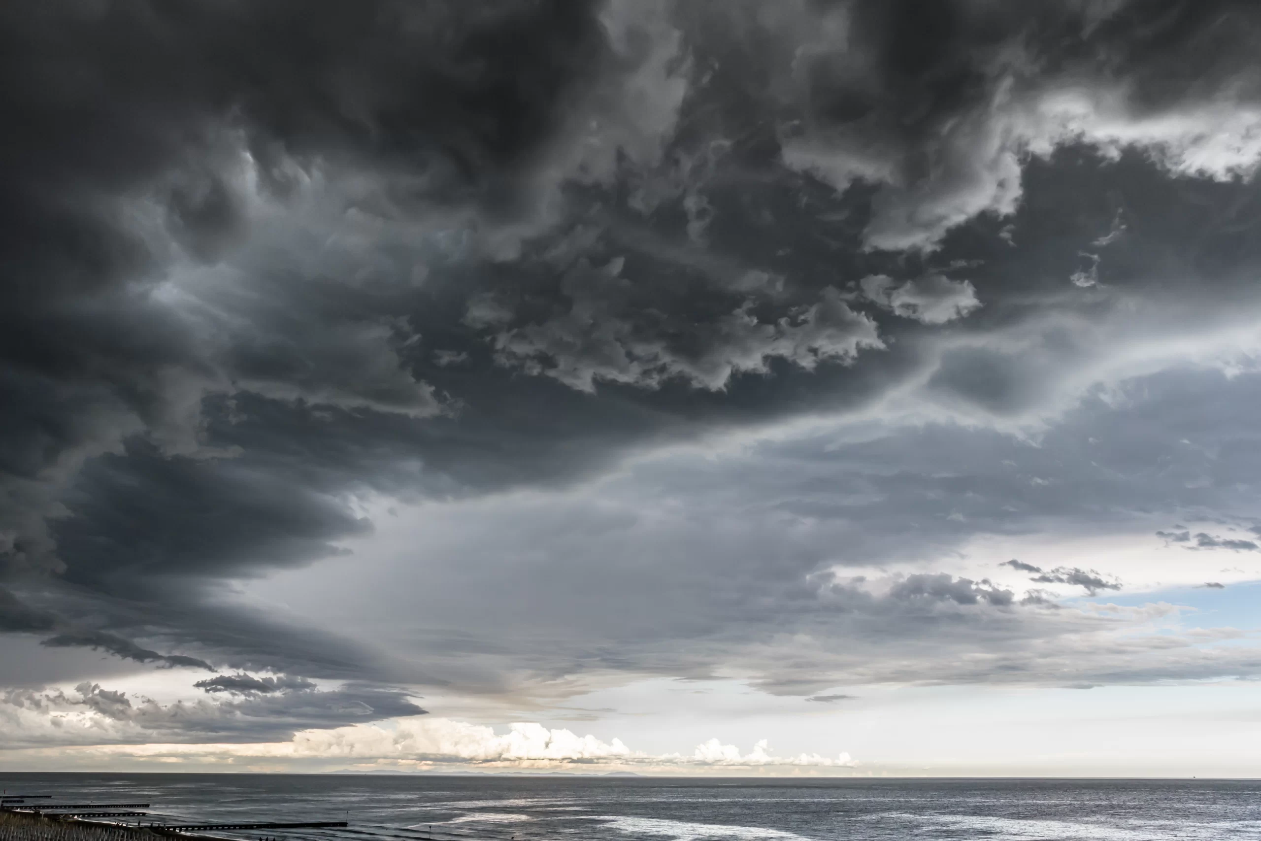 Another Florida Hurricane in November How to Prepare for the Worst- OTM Restoration - Approaching storm cloud with rain over the sea