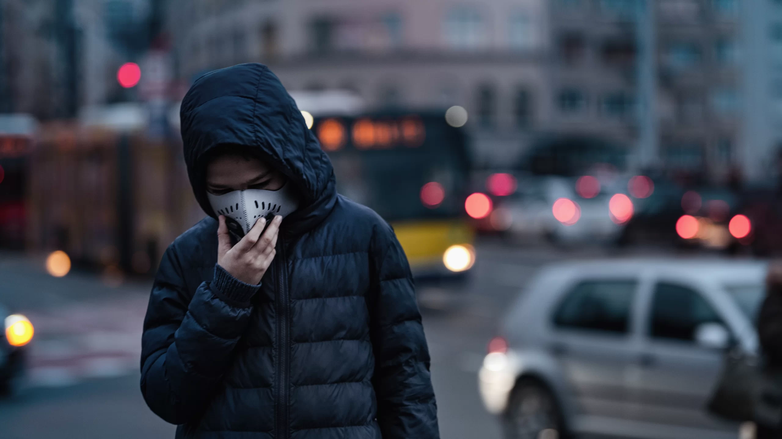 Air Quality | Nearly 600,000 Kids Under 5 Die From Air Pollution. Poor Air Quality. Boy on the City Street Wearing Anti-Pollution Mask.